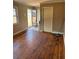 Spacious living room with hardwood floors, backyard access, and a neutral color palette at 542 Sugar Hill Nw Dr, Marietta, GA 30060