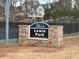 Lewis Park brick welcome sign with a tennis court in the background at 542 Sugar Hill Nw Dr, Marietta, GA 30060