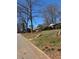 Quiet residential street showcasing the neighborhood's mature trees and traditional homes at 542 Sugar Hill Nw Dr, Marietta, GA 30060