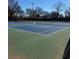 A well-maintained tennis court offers residents recreational opportunities and a vibrant community atmosphere at 542 Sugar Hill Nw Dr, Marietta, GA 30060