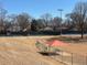 View of the tennis courts at Lewis Park with a covered bench at 542 Sugar Hill Nw Dr, Marietta, GA 30060