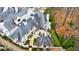 Aerial view of the luxury home with patio, outdoor seating, and lush landscaping at 225 Dovecrest Dr, Atlanta, GA 30305