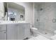 Bright bathroom featuring a marble shower, sleek vanity, and minimalist design elements at 225 Dovecrest Dr, Atlanta, GA 30305