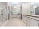Spacious bathroom with double vanity, frameless shower, modern lighting, and designer finishes at 225 Dovecrest Dr, Atlanta, GA 30305