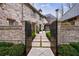Charming home entrance with a brick facade, manicured landscaping, and a walkway at 225 Dovecrest Dr, Atlanta, GA 30305