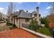 Elegant brick home with brick driveway, well maintained yard, and wrought iron railing and fencing at 225 Dovecrest Dr, Atlanta, GA 30305