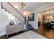 Elegant foyer with a view of the staircase, stylish console table, and hardwood floors at 225 Dovecrest Dr, Atlanta, GA 30305