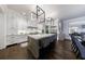 Modern eat-in kitchen with gray cabinets, stainless appliances, and cube pendant lighting at 225 Dovecrest Dr, Atlanta, GA 30305