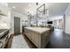 Modern eat-in kitchen with gray cabinets, stainless appliances, and cube pendant lighting at 225 Dovecrest Dr, Atlanta, GA 30305