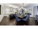 Open-concept kitchen and dining area featuring modern lighting, sleek countertops, and ample seating at 225 Dovecrest Dr, Atlanta, GA 30305