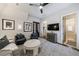 Cozy living room with plush seating, modern ceiling fan, and stylish decor at 225 Dovecrest Dr, Atlanta, GA 30305