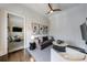 Cozy living room area with plush seating, stylish decor, and an adjacent media room for entertainment at 225 Dovecrest Dr, Atlanta, GA 30305