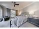 Calm main bedroom with a king-size bed, gray dresser, and sliding barn doors at 225 Dovecrest Dr, Atlanta, GA 30305