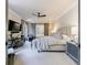 Serene main bedroom featuring a king-size bed, sliding barn doors, and a ceiling fan at 225 Dovecrest Dr, Atlanta, GA 30305