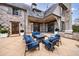 Inviting outdoor patio with comfortable seating around a fire pit and a built-in grill, perfect for entertaining at 225 Dovecrest Dr, Atlanta, GA 30305