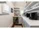Well-organized butler's pantry with open shelving, a beverage cooler, and ample counter space at 225 Dovecrest Dr, Atlanta, GA 30305