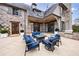 Beautiful patio with modern furniture and a fire pit, perfect for outdoor entertaining at 225 Dovecrest Dr, Atlanta, GA 30305