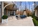 Lovely patio features an outdoor fireplace and dining area, ideal for gatherings at 225 Dovecrest Dr, Atlanta, GA 30305