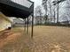 This backyard features an unfinished lawn and view of the deck at 2655 Fort Apachee Trl, Dacula, GA 30019