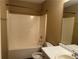 Bathroom with shower and tub combo, white vanity and mirror at 2655 Fort Apachee Trl, Dacula, GA 30019