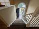 View of entryway stairs leading to front door with transom window providing natural light at 2655 Fort Apachee Trl, Dacula, GA 30019