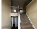 A carpeted staircase is the focus point as one enters the home at 2655 Fort Apachee Trl, Dacula, GA 30019
