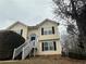 Inviting two-story home featuring a welcoming front porch and well-maintained landscaping at 2655 Fort Apachee Trl, Dacula, GA 30019