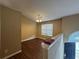 Inviting space with hardwood floors, a ceiling fan and a light fixture at 2655 Fort Apachee Trl, Dacula, GA 30019