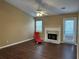 Cozy living room featuring a fireplace and access to the backyard at 2655 Fort Apachee Trl, Dacula, GA 30019