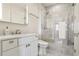 Bright bathroom with chrome fixtures, marble shower, and sleek design at 2828 Peachtree Nw Rd # 1002, Atlanta, GA 30305