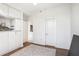Bonus room features built in storage, white walls, and neutral colored area rug at 2828 Peachtree Nw Rd # 1002, Atlanta, GA 30305