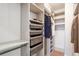Walk-in closet offers built-in shelving and storage for clothes and accessories at 2828 Peachtree Nw Rd # 1002, Atlanta, GA 30305