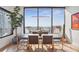 Bright dining room with modern table, chairs, and large windows at 2828 Peachtree Nw Rd # 1002, Atlanta, GA 30305