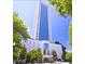 Modern high-rise building with stunning architectural design and lush green landscaping at 2828 Peachtree Nw Rd # 1002, Atlanta, GA 30305