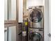 Stacked washer and dryer hookups in the laundry room with closet at 2828 Peachtree Nw Rd # 1002, Atlanta, GA 30305