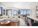 Open-concept living area with hardwood floors, modern lighting and city views at 2828 Peachtree Nw Rd # 1002, Atlanta, GA 30305