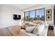 Bright living room with modern decor, sleek furniture, and city views at 2828 Peachtree Nw Rd # 1002, Atlanta, GA 30305