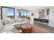 Expansive living space with hardwood floors, city views, a modern kitchen, and comfortable seating at 2828 Peachtree Nw Rd # 1002, Atlanta, GA 30305