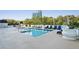 Enjoy the sun with blue lounge chairs surrounding the pool at 2828 Peachtree Nw Rd # 1002, Atlanta, GA 30305