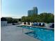 Beautiful rooftop pool with lounge chairs and city views at 2828 Peachtree Nw Rd # 1002, Atlanta, GA 30305