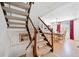 Carpeted staircase leading to a dining area with wood floors and large window at 288 Roswell Commons Cir, Roswell, GA 30076