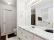 Bright bathroom features white vanity, large mirror, and tiled floors at 403 Keys Ferry Rd, Mcdonough, GA 30252