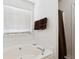 A modern soaking tub is showcased with a window view and neutral tones at 403 Keys Ferry Rd, Mcdonough, GA 30252