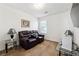Comfortable bedroom featuring a cozy seating area and ample natural light at 403 Keys Ferry Rd, Mcdonough, GA 30252