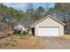 Charming single-story home with a two-car garage and well-maintained front lawn at 403 Keys Ferry Rd, Mcdonough, GA 30252