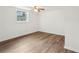 Bright bedroom with a ceiling fan and wood-look flooring at 4042 Sweetbriar Ln, Forest Park, GA 30297