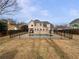 Large backyard with an in-ground pool surrounded by a black metal fence at 439 Emerald Trce, Jonesboro, GA 30236
