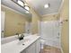 A bathroom featuring a vanity, an expansive mirror, and a shower-tub combo at 439 Emerald Trce, Jonesboro, GA 30236