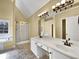Bright bathroom with double sink vanity, soaking tub, and separate shower at 439 Emerald Trce, Jonesboro, GA 30236