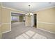Open-concept dining area adjacent to the living room and kitchen at 439 Emerald Trce, Jonesboro, GA 30236